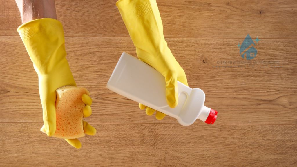 Maid vs. Housekeeper: What’s the Difference and Which Do You Need? rubber gloves cleaning supplies lakewood denver maid service cleaning bottle wood floors apartment homes condos rentals